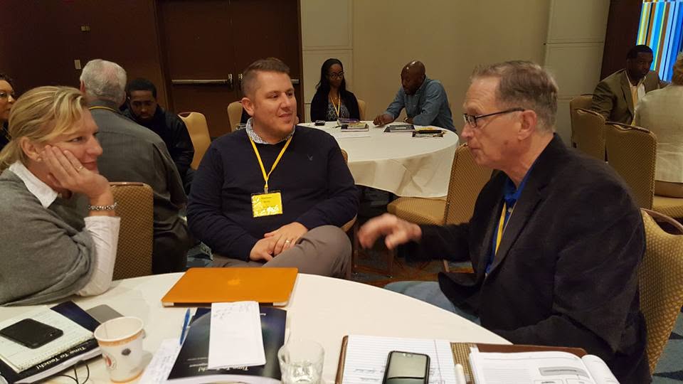 Phebe Hibshman in conversation with educators at a round-table workshop session